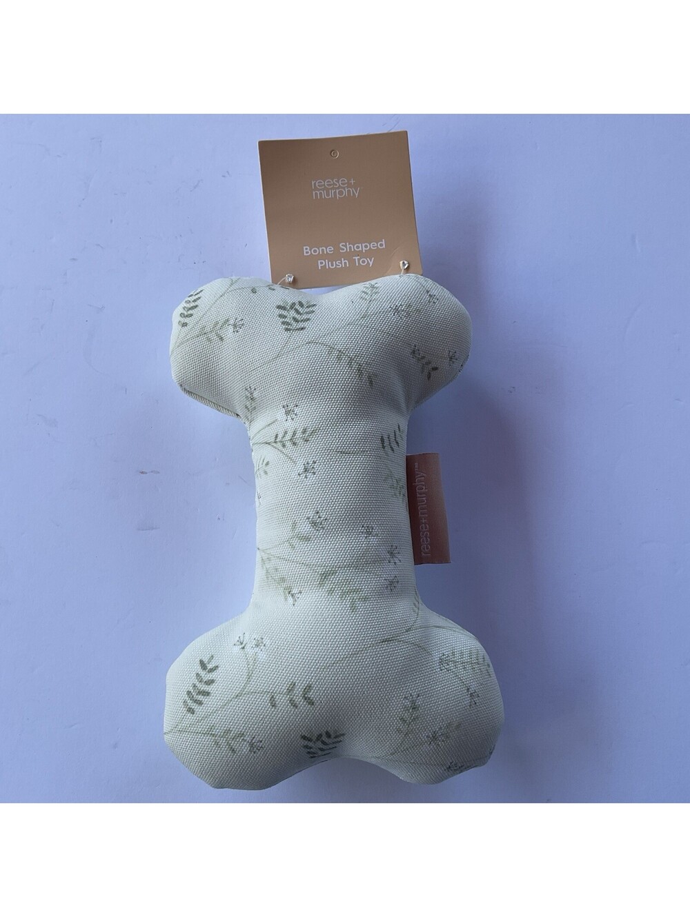 Green and Ivory Floral Bone Shaped Plush Toy by Reese + Murphy